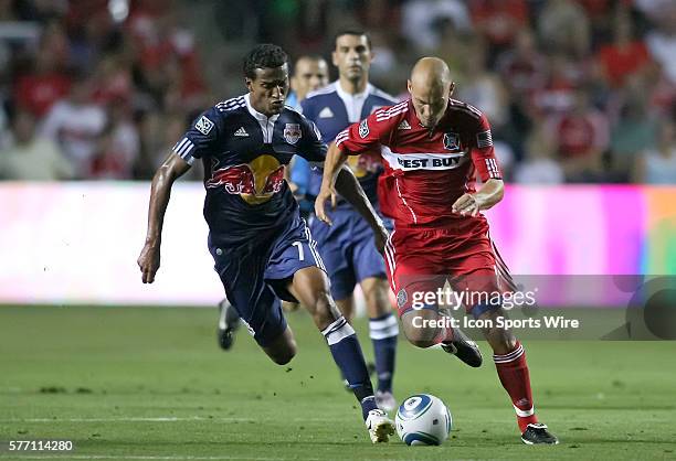 Chicago Fire midfielder Freddie Ljungberg and Red Bulls defender Roy Miller battle over a loose ball in game action. The New York Red Bulls drew a...