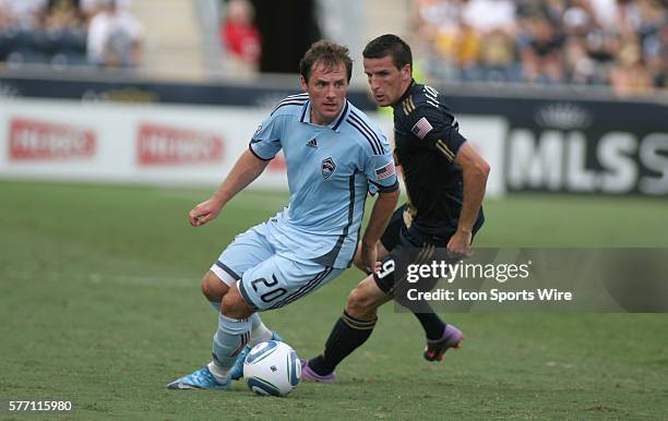 Colorado Rapids' Jamie Smith keeps the ball away from Philadelphia Union's Sebastien Le Toux during the first half of the Colorado Rapids vs...