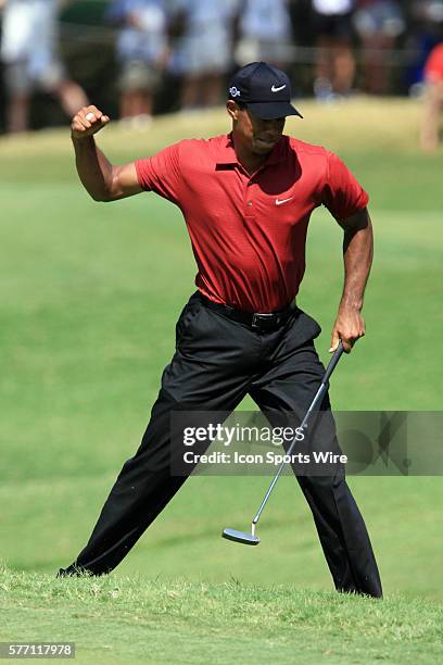 Tiger Woods pumps his fist after draining a birdie on the 8th green during the final round of the 89th PGA Championship at Southern Hills Country...