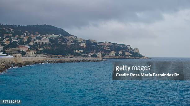 view of the beach in nice, france, near the promenade des anglais, on summer hot day - south of france stock-fotos und bilder