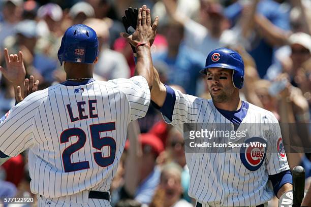 Chicago Cubs first baseman Derrek Lee is congratulated at home by shortstop Ryan Theriot . The Chicago Cubs defeated the Milwaukee Brewers 5-1 at...