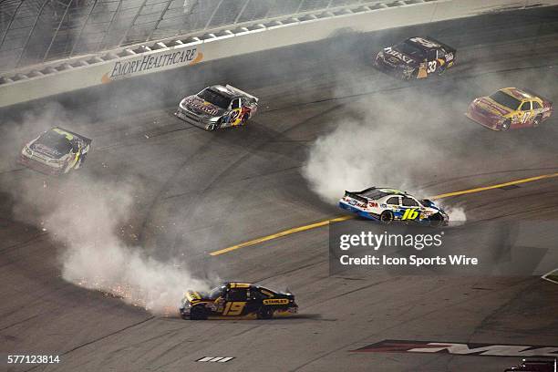 Greg Biffle 3M Ford and Elliott Sadler Stanley Ford wreck coming out of turn four of the Emory Healthcare 500 at Atlanta Motor Speedway in Hampton,...