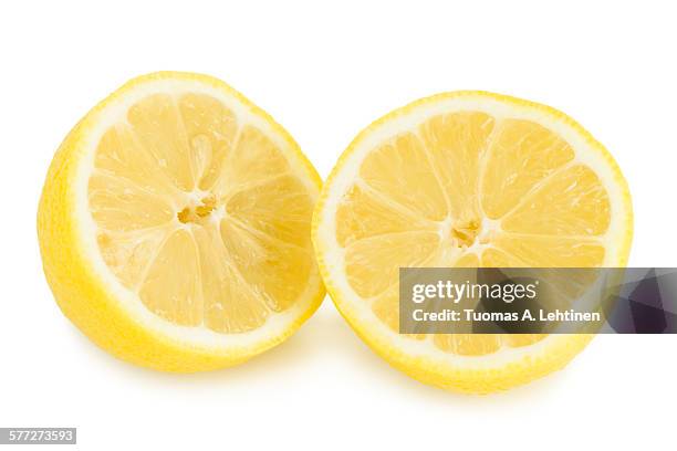 closeup of a lemon cut in half - half and half stock pictures, royalty-free photos & images