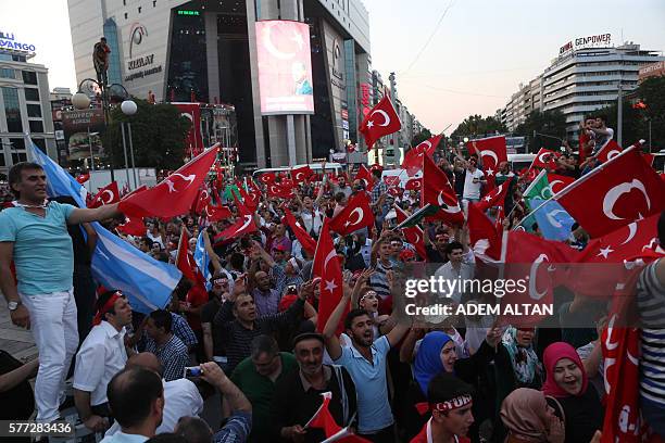 People gather at Kizilay Square in Ankara on July 18, 2016 to protest against Parallel State/Gulenist Terrorist Organization's failed military coup...