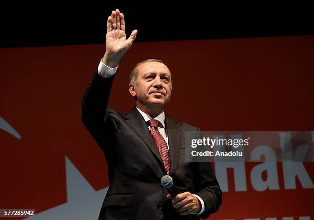 Turkish President Recep Tayyip Erdogan greets the crowd who gathered in front of his residence in Kisikli to protest against Parallel State/Gulenist...