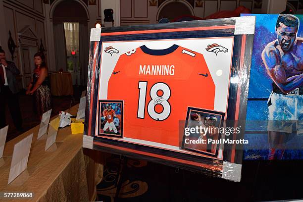 Autographed Peyton Manning jersey to raise money in the silent auction for the 4th Annual "David Ortiz Children's Fund Gala" in partnership with Mass...