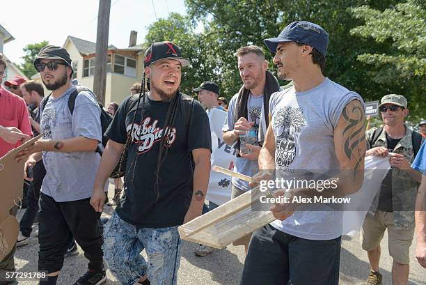 Rodstarz of Rebel Diaz and Brad Wilk of Prophets of Rage join protestors during the Poverty Now! march downtown to RNC on July 18, 2016 in Cleveland,...