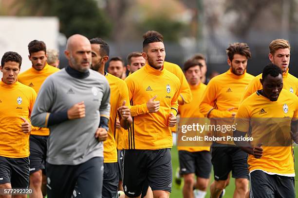 Players run laps during warm up after the Juventus FC welcome ceremony at Lakeside Stadium on July 19, 2016 in Melbourne, Australia.