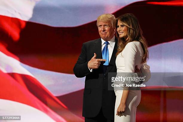 Presumptive Republican presidential nominee Donald Trump gestures to his wife Melania after she delivered a speech on the first day of the Republican...