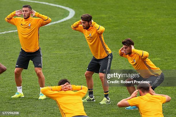 Players stretch during warm up after the Juventus FC welcome ceremony at Lakeside Stadium on July 19, 2016 in Melbourne, Australia.