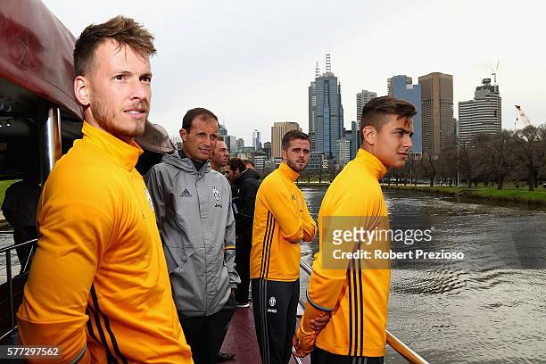 Manager Massimiliano Allegri poses with players during a Juventus boat ride along the Yarra River on July 19, 2016 in Melbourne, Australia.
