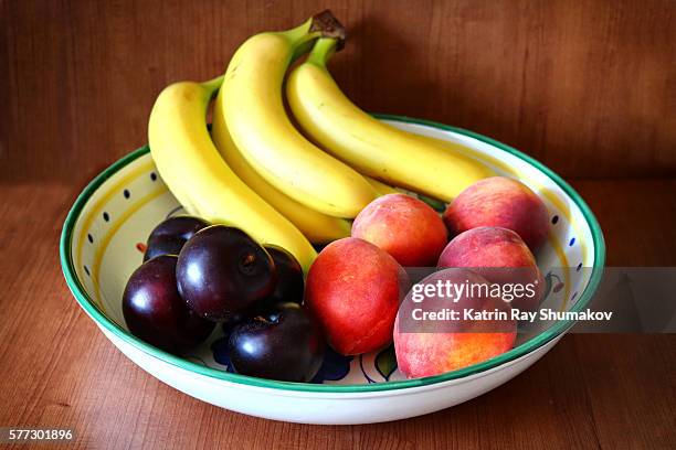 banana-peachy bowl of fruits - fruit bowl stock pictures, royalty-free photos & images