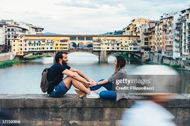 couple in love near ponte vecchio bridge in florence - honeymoon europe stock pictures, royalty-free photos & images