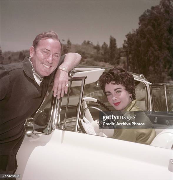 British-born American actress Elizabeth Taylor with her husband, British actor Michael Wilding , circa 1955.