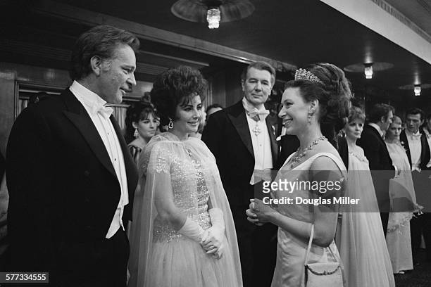 Princess Margaret chatting to Richard Burton and his wife Elizabeth Taylor at the Royal Film Performance of 'The Taming Of The Shrew', which stars...