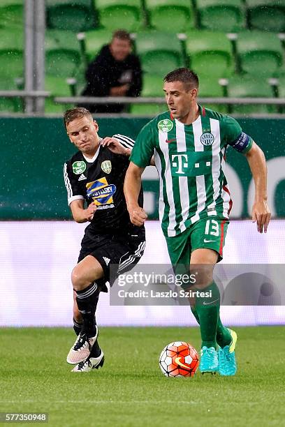 Daniel Bode of Ferencvarosi TC controls the ball next to Sjoerd Overgoor of Swietelsky Haladas during the Hungarian OTP Bank Liga match between...