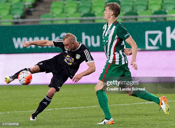 Oliver Husing of Ferencvarosi TC tries to block the shot from Sjoerd Ars of Swietelsky Haladas during the Hungarian OTP Bank Liga match between...