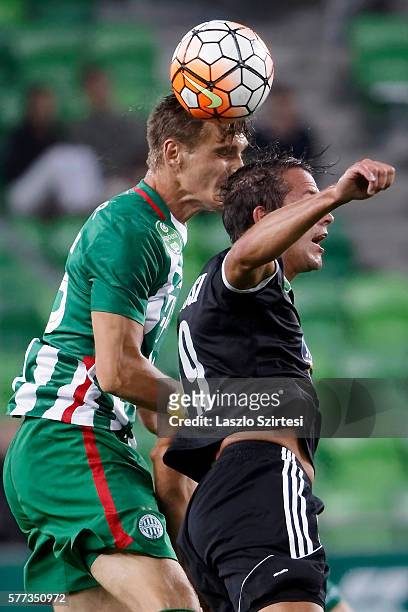 Emir Dilaver of Ferencvarosi TC battles for the ball in the air with Sjoerd Ars of Swietelsky Haladas during the Hungarian OTP Bank Liga match...