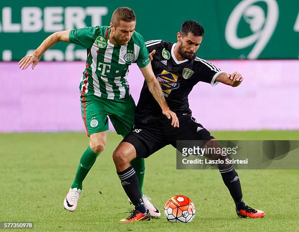 Stanislav Sestak of Ferencvarosi TC fights for the ball with Predrag Bosnjak of Swietelsky Haladas during the Hungarian OTP Bank Liga match between...