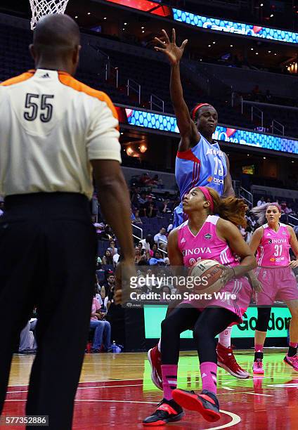 Tianna Hawkins of the Washington Mystics is defended by Aneika Henry of the Atlanta Dream during a WNBA game at Verizon Center, in Washington D.C....