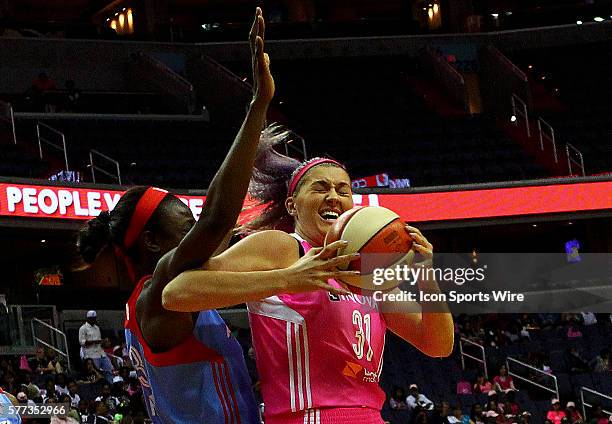 Stefanie Dolson of the Washington Mystics battles under the basket with Aneika Henry of the Atlanta Dream during a WNBA game at Verizon Center, in...