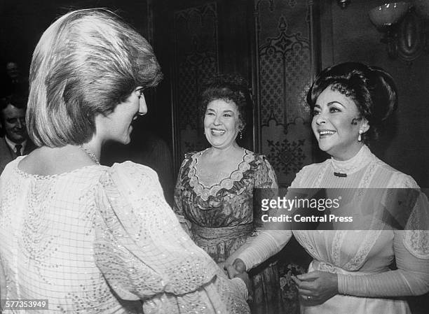 British-born American actress Elizabeth Taylor greets Diana Princess of Wales backstage at the Victoria Palace Theatre after a charity premiere of...