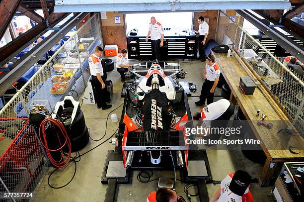 Penske team works on driver Ryan Briscoe car during the final practice for the Honda Indy 200 at Mid Ohio.