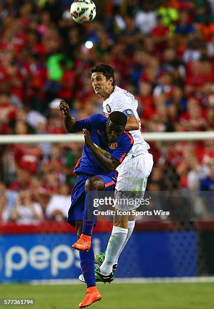 Tyler Blackett of Manchester United loses a header to Andrea Ranocchia of Inter Milan during an International Champions Cup match at Fedex Field, in...