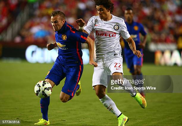 Tom Cleverley of Manchester United is challenged by Dodo of Inter Milan during an International Champions Cup match at Fedex Field, in Landover,...
