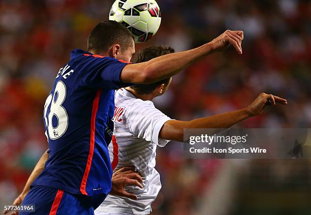Michael Keane of Manchester United heads away from Ruben Botta of Inter Milan during an International Champions Cup match at Fedex Field, in...