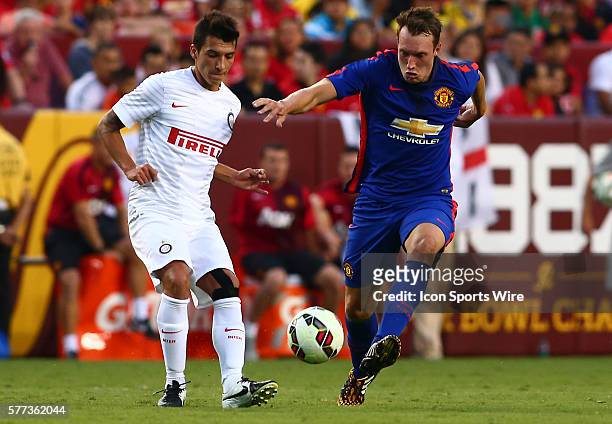Tom Cleverley of Manchester United goes for the ball with Ruben Botta of Inter Milan during an International Champions Cup match at Fedex Field, in...