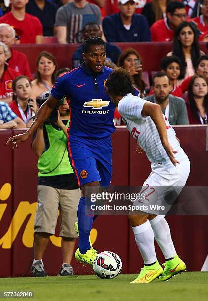 Antonio Valencia of Manchester United controls the ball in front of Dodo of Inter Milan during an International Champions Cup match at Fedex Field,...