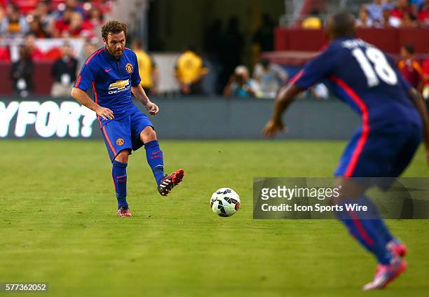Juan Mata of Manchester United passes to Ashley Young against Inter Milan during an International Champions Cup match at Fedex Field, in Landover,...