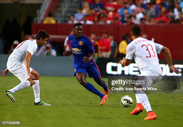 Danny Welbeck of Manchester United passes the ball between Freddy Guarin and Danilo D'Ambrosio of Inter Milan during an International Champions Cup...