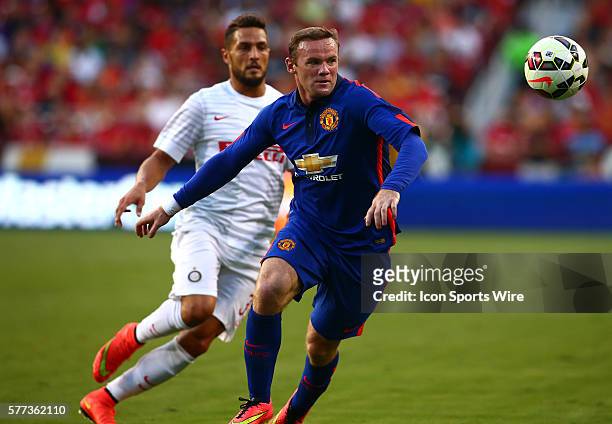 Wayne Rooney of Manchester United pushes the ball away from Danilo D'Ambrosio of Inter Milan during an International Champions Cup match at Fedex...