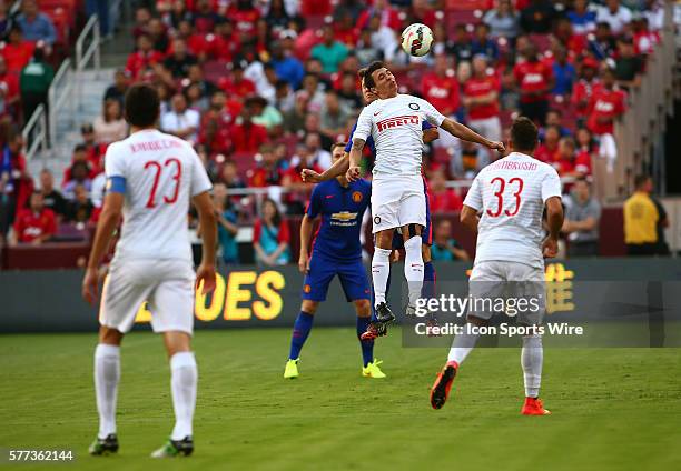 Ander Herrera of Manchester United is beaten to a header by Saphir Taider of Inter Milan during an International Champions Cup match at Fedex Field,...