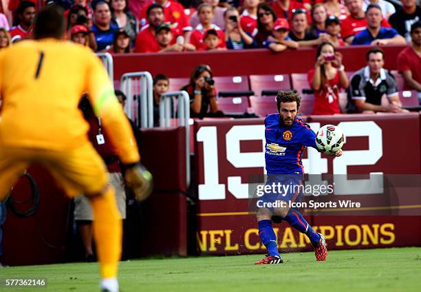 Juan Mata of Manchester United sends a cross past Samir Handanovic of Inter Milan during an International Champions Cup match at Fedex Field, in...