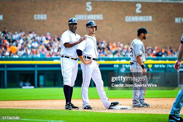 July 31, 2014 - Detroit, MI Detroit Tigers third base coach Dave Clark talks to Detroit Tigers shortstop Eugenio Suarez at third base during the game...