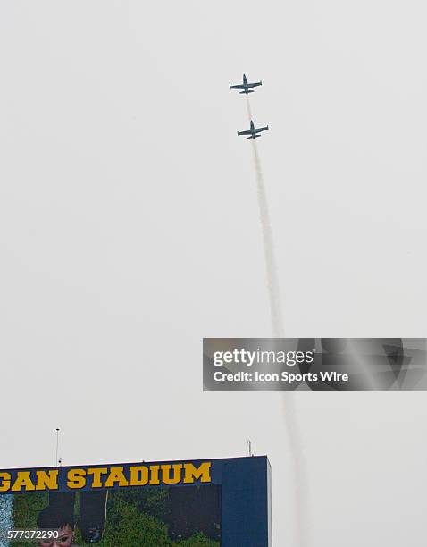 Two jets do a flyover during the playing of the national anthem before a Guinness International Champions Cup match between Manchester United and...