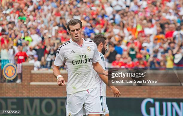 Real Madrid forward Gareth Bale celebrates his successful penalty goal kick scored during a Guinness International Champions Cup match between...
