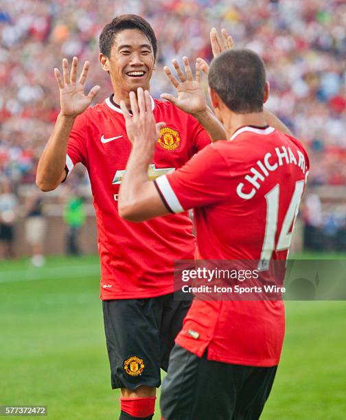 Manchester United midfielder Shinji Kagawa celebrates a goal scored by forward Javier Hern??ndez during a Guinness International Champions Cup match...