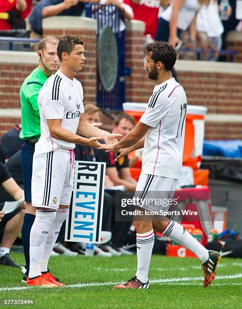 Real Madrid forward Cristiano Ronaldo, left, subs out defender ??lvaro Arbeloa , during a Guinness International Champions Cup match between...