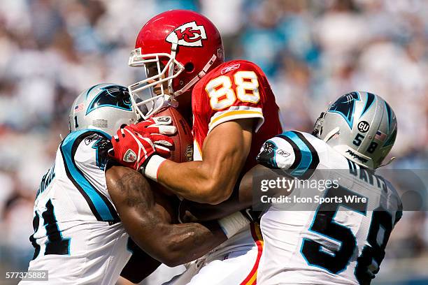 Carolina Panthers cornerback Richard Marshall and linebacker Thomas Davis tackle Kansas City Chiefs tight end Tony Gonzalez during an NFL football...