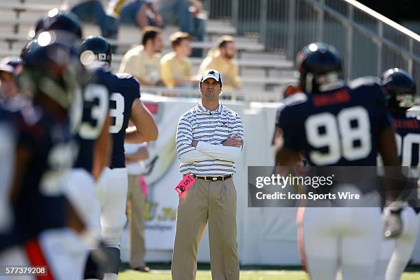 Virginia Offensive Coordinator Mike Groh watches the team warm up in the Virginia Cavaliers 24-17 victory over the Georgia Tech Yellow Jackets at...
