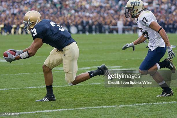 Notre Dame Wide Receiver Michael Floyd makes a catch with Pitt Panthers Aaron Berry in coverage during the NCAA college football game between the...