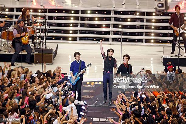 November 2008 - The Jonas Brothers perform at halftime of the Thanksgiving day game between the Dallas Cowboys and the Seattle Seahawks at Texas...