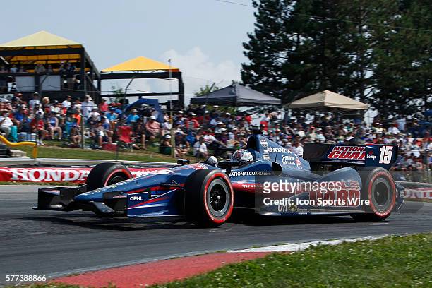 The fans watch IndyCar Driver Graham Rahal in action during The Honda Indy 200 at the Mid-Ohio Sports Car Course in Lexington, OH
