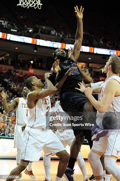 Kansas State forward Thomas Gipson goes for a rebound as he is surrounded by Demarcus Holland, Connor Lammert, Damarcus Croaker and Isaiah Taylor...