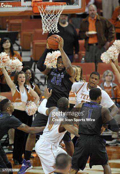 Kansas State forward Thomas Gipson pulls in a rebound during 67 - 64 loss to the Longhorns at the Frank Erwin Center in Austin, TX.