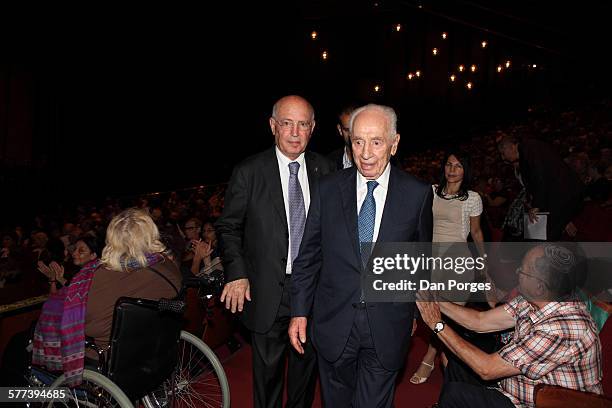 View of the head of the Jerusalem Academy of Music and Dance's Board of Directors Yair Green and former Israeli President Shimon Peres as they walk...